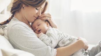 Mother holding child close