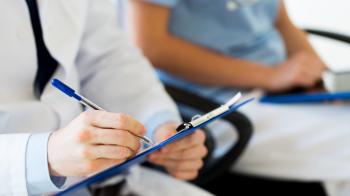 Person taking notes on a clipboard