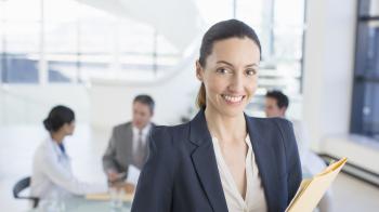 Professional woman standing near a meeting