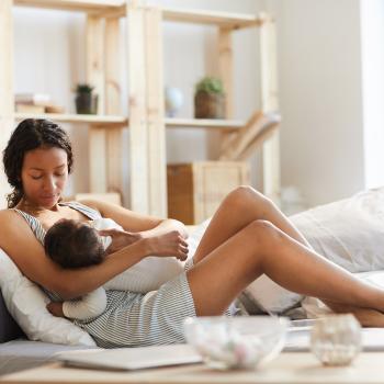 Mother and baby on couch