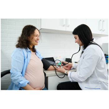 Pregnant patient getting blood pressure checked by doctor