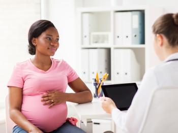 Pregnant patient at a checkup with their doctor