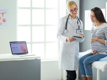 Pregnant woman meeting with her doctor