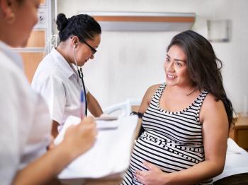 Pregnant patient with healthcare staff