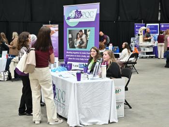 KyPQC Table and Staff speaking with meeting attendees